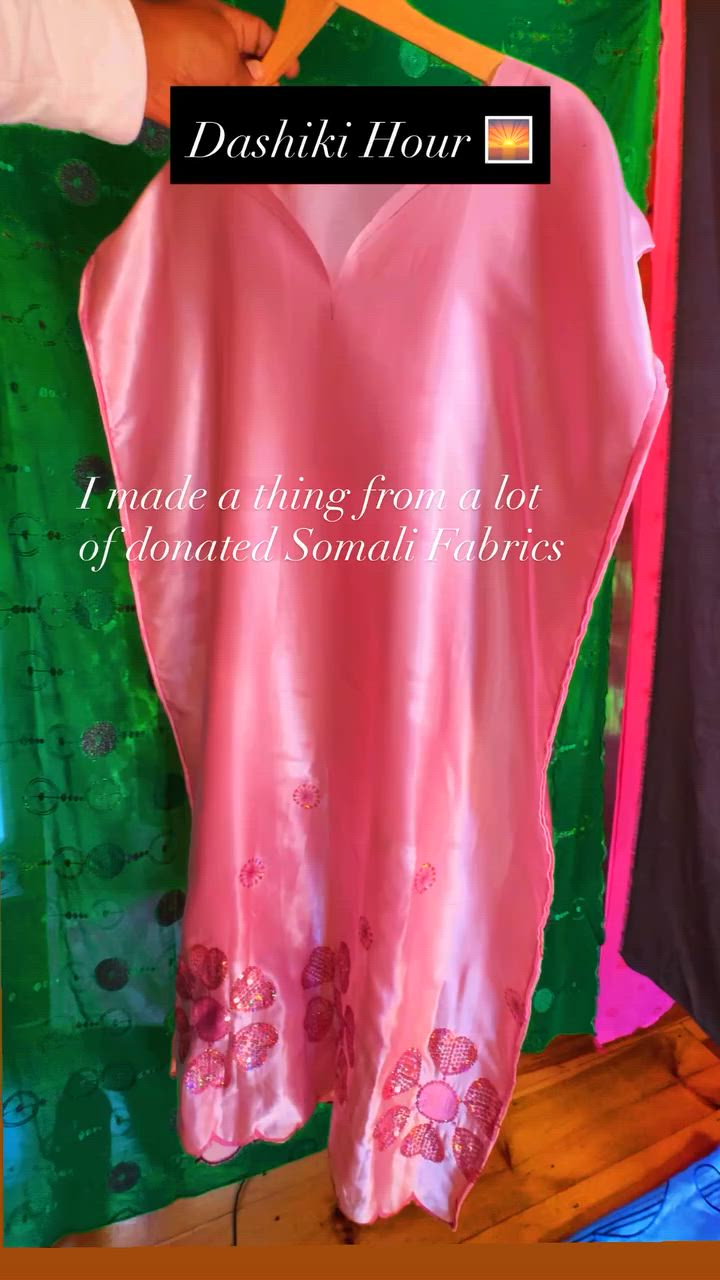 Still from Kristopher’s film showing a colorful handmade garment on a hanger.
