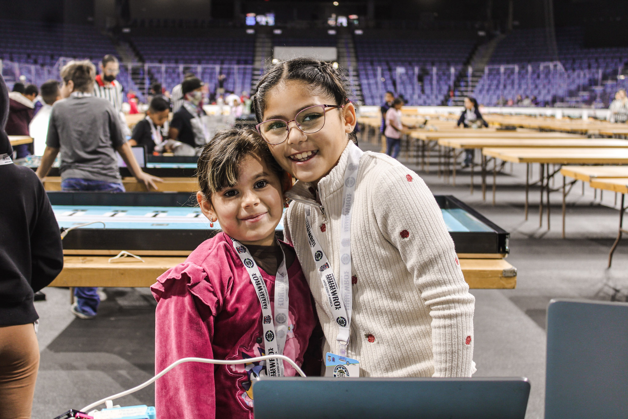 Two students together smiling