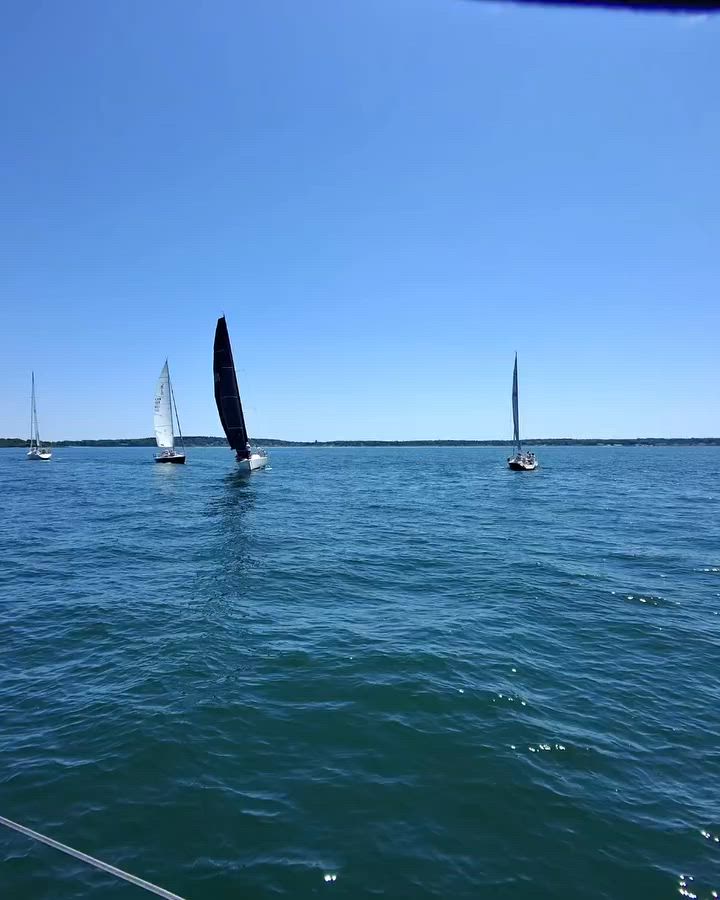 POV clips show sailing, beach, rocky stream and car interior; dark-glasses portrait. Sailing cover chosen.
