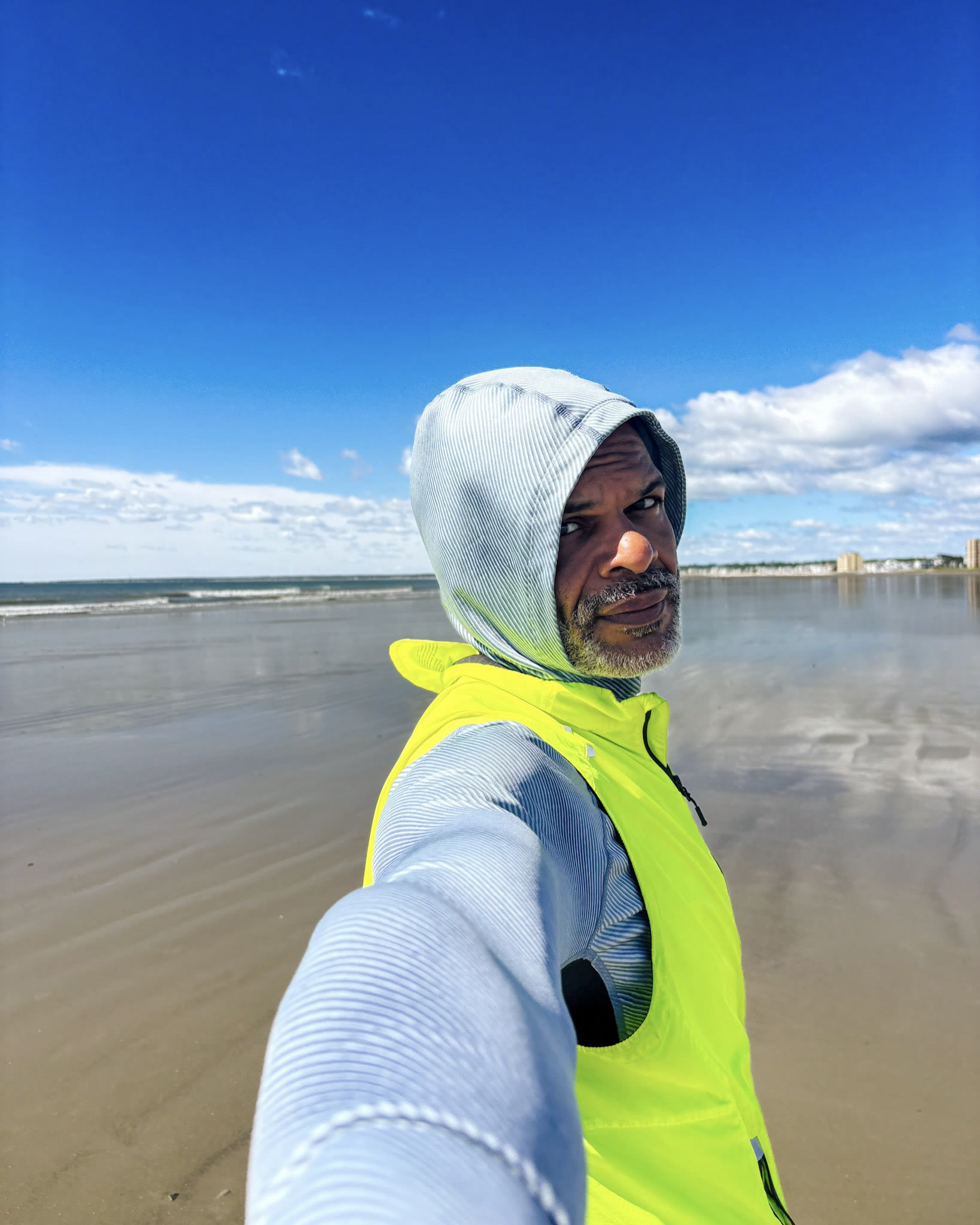 Coastal hooded self-portrait and a shoreline image.