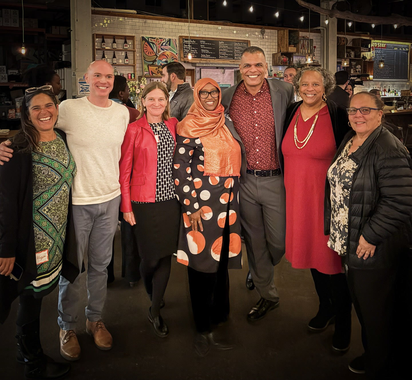 Kristopher with a group at a community fundraising event.