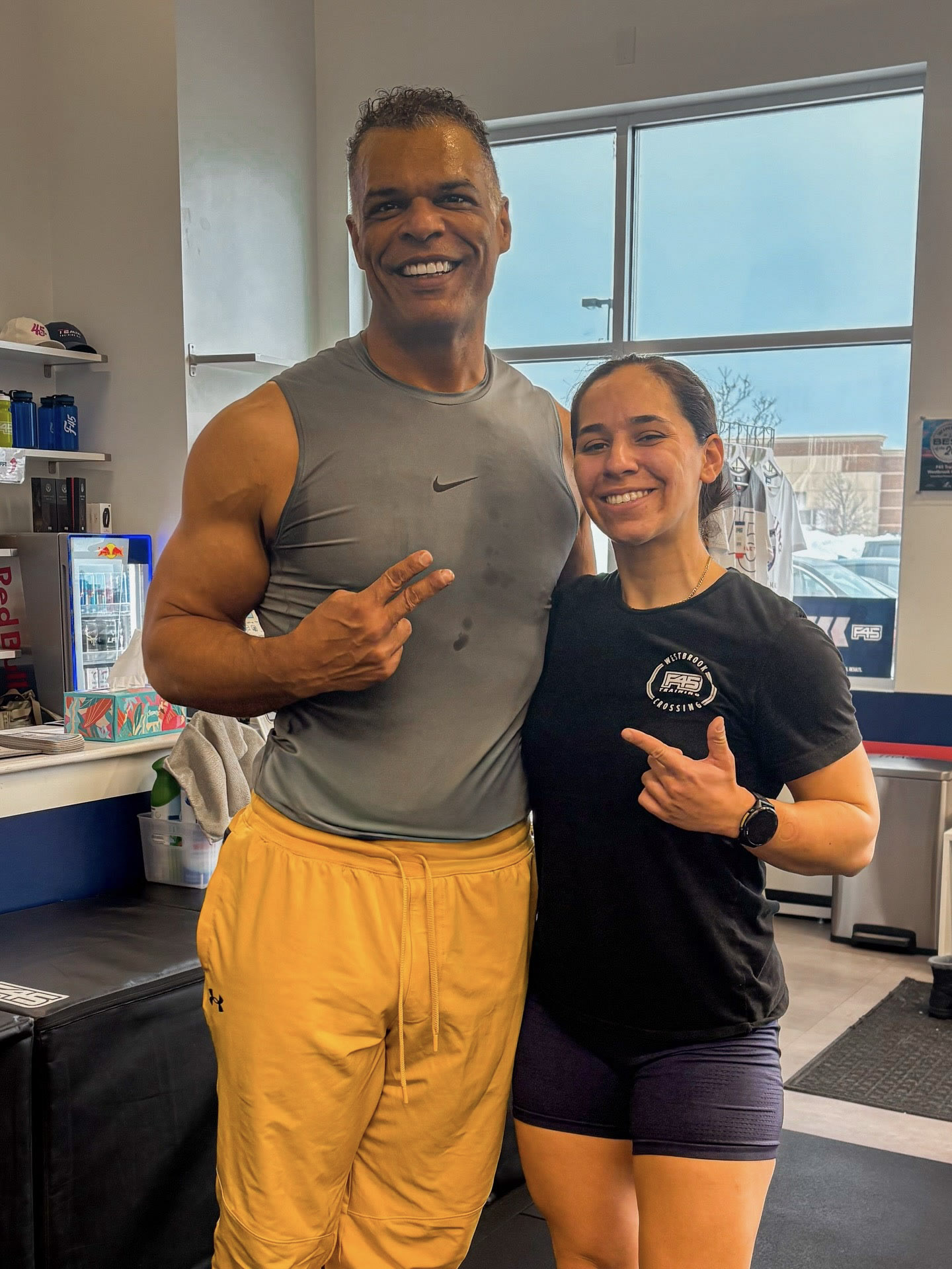 Kristopher and a trainer smiling together at F45 Westbrook Crossing.