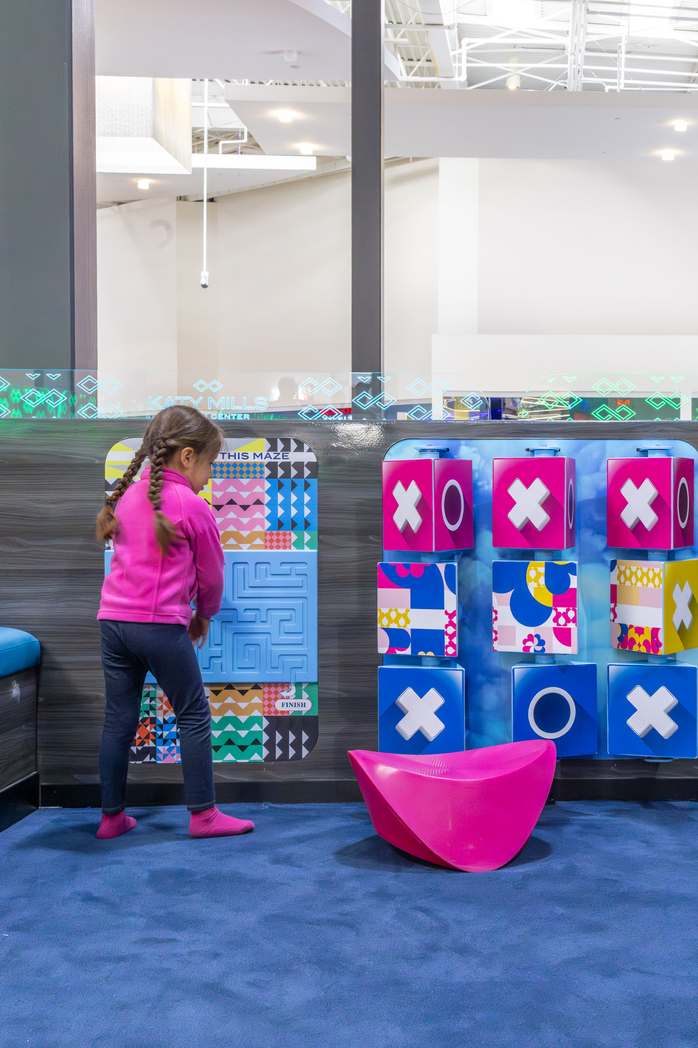 Child playing in the newly updated play area at Katy Mills.